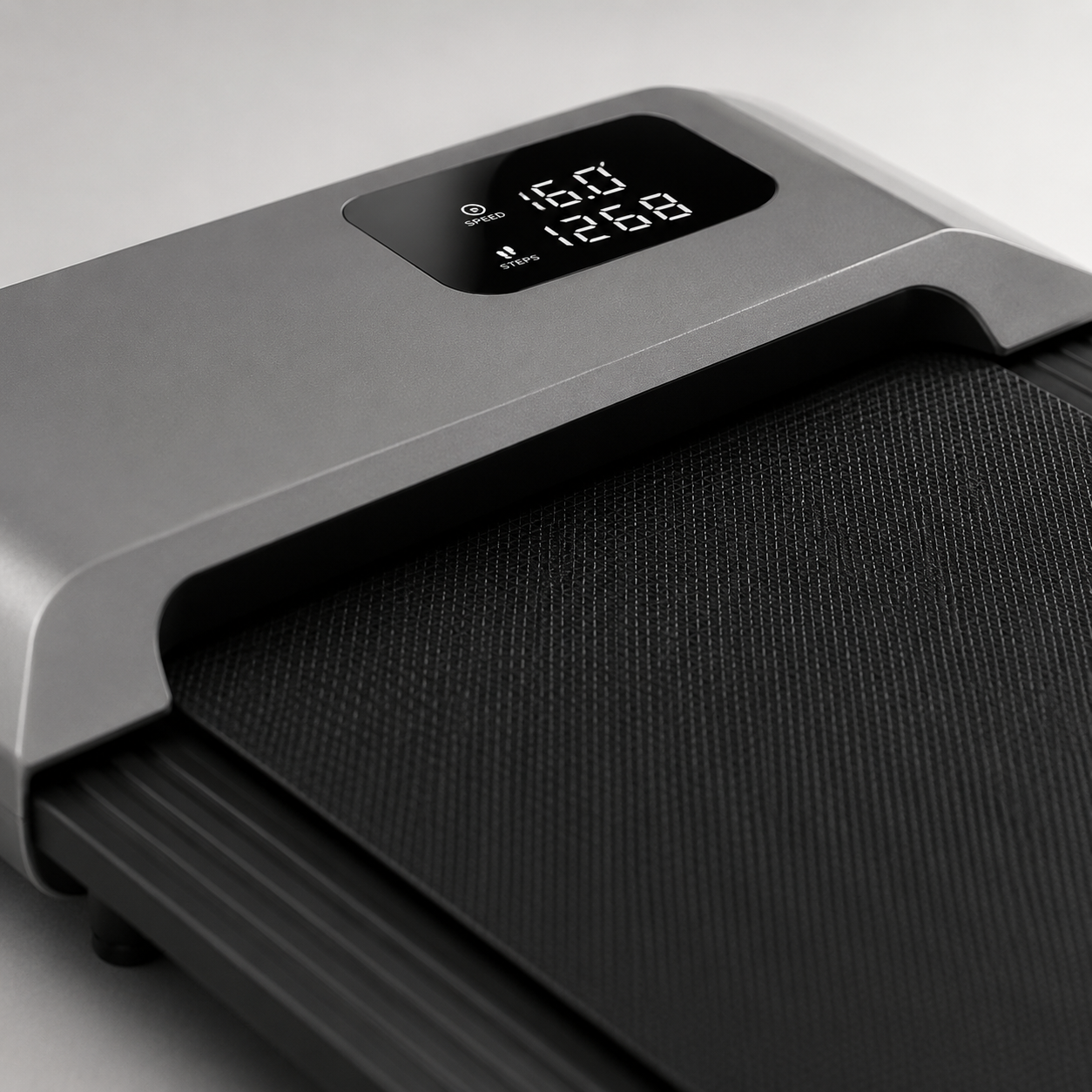 Close-up of the Understride walking pad LED display showing speed and step count