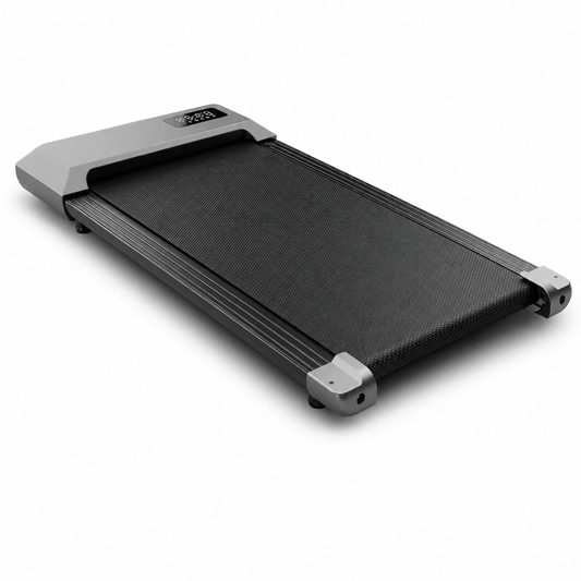 Understride under-desk walking pad treadmill on a clean white studio background, slim charcoal running belt and LED display
